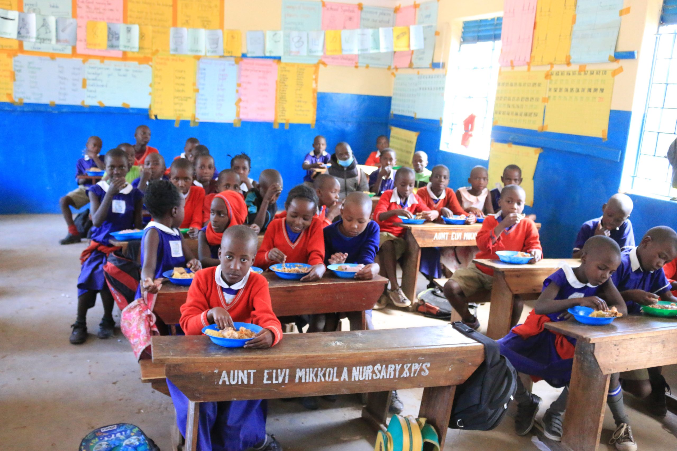 A group of children in a classroom A group of children in a classroom