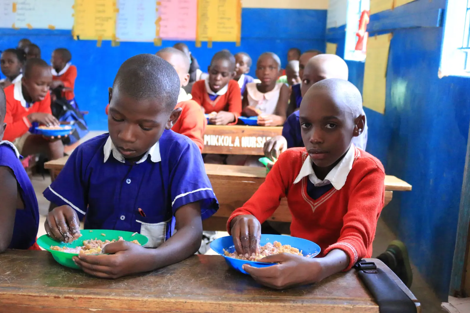 Children writing in their school books Children writing in their school books