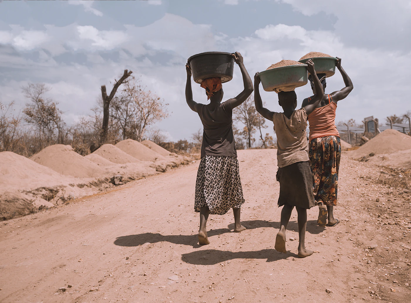 Three women walking together in Uganda Three women walking together in Uganda